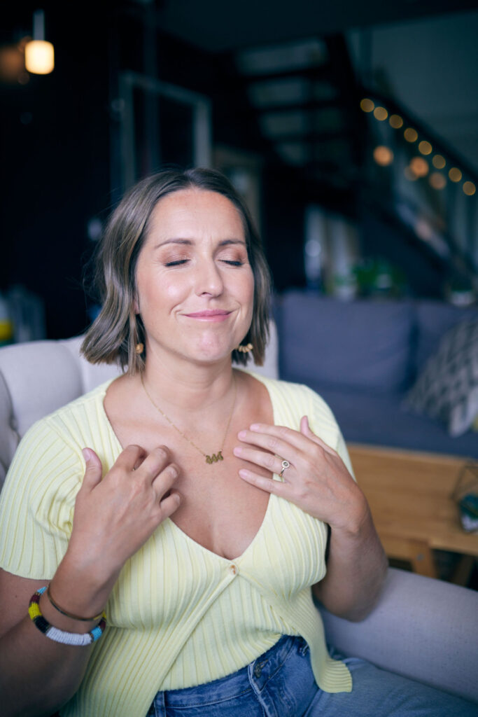Woman practicing EFT tapping for perimenopause to calm her nervous system